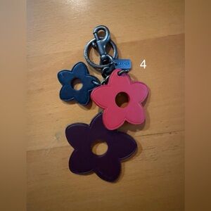 Coach Leather Wild Flower Bag Charm in Mauve, Red, and Black. (4)